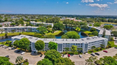 SPECTACULAR CONDO WITH AMAZING WATER VIEW FROM THE 4TH FLOOR on Hillsboro Pines Golf in Florida - for sale on GolfHomes.com, golf home, golf lot
