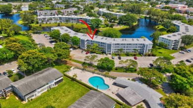 SPECTACULAR CONDO WITH AMAZING WATER VIEW FROM THE 4TH FLOOR on Hillsboro Pines Golf in Florida - for sale on GolfHomes.com, golf home, golf lot
