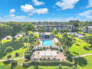 Indulge in the essence of modern living within this meticulous on Fountains Golf and Country Club in Florida - for sale on GolfHomes.com, golf home, golf lot