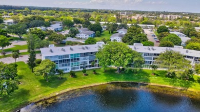 SPECTACULAR CONDO WITH AMAZING WATER VIEW FROM THE 4TH FLOOR on Hillsboro Pines Golf in Florida - for sale on GolfHomes.com, golf home, golf lot