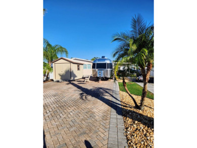 This sweet lot has it all; upgraded pavers, suitable for any on Deer Creek RV Golf Resort in Florida - for sale on GolfHomes.com, golf home, golf lot