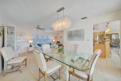 Situated on a desirable oversized corner lot with a on Twin Isles Country Club in Florida - for sale on GolfHomes.com, golf home, golf lot