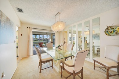 Situated on a desirable oversized corner lot with a on Twin Isles Country Club in Florida - for sale on GolfHomes.com, golf home, golf lot