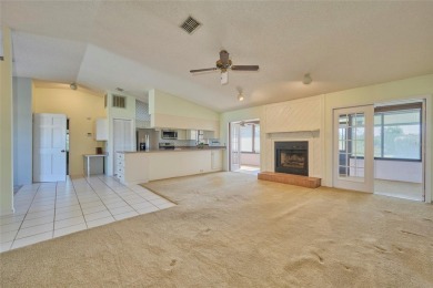 Beautiful family home on a full acre (2 lots) in the lake and on Indian Lake Estates Golf and Country Club in Florida - for sale on GolfHomes.com, golf home, golf lot
