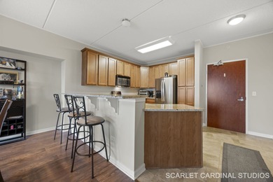 Well-maintained 7th-floor unit featuring two spacious bedrooms on Seven Bridges Golf Club in Illinois - for sale on GolfHomes.com, golf home, golf lot