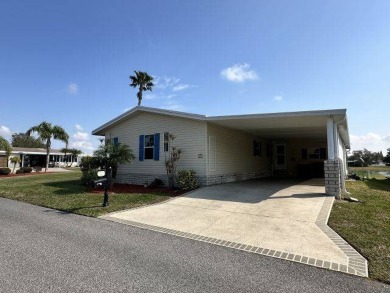 Located on a prime corner lot directly across from the clubhouse on Four Lakes Golf Club in Florida - for sale on GolfHomes.com, golf home, golf lot
