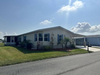 Located on a prime corner lot directly across from the clubhouse on Four Lakes Golf Club in Florida - for sale on GolfHomes.com, golf home, golf lot