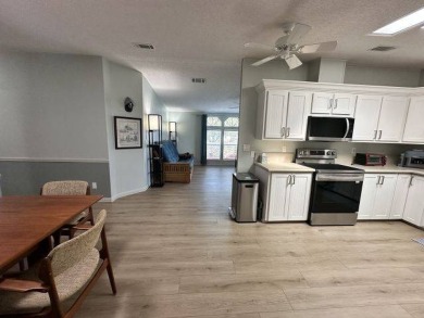 Located on a prime corner lot directly across from the clubhouse on Four Lakes Golf Club in Florida - for sale on GolfHomes.com, golf home, golf lot