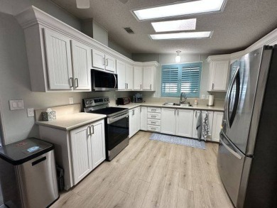 Located on a prime corner lot directly across from the clubhouse on Four Lakes Golf Club in Florida - for sale on GolfHomes.com, golf home, golf lot
