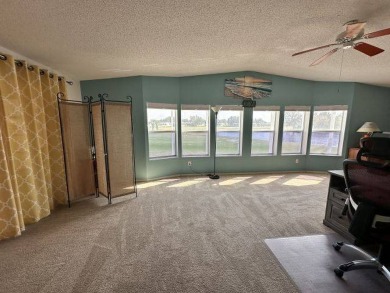 Located on a prime corner lot directly across from the clubhouse on Four Lakes Golf Club in Florida - for sale on GolfHomes.com, golf home, golf lot