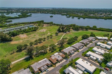 This villa has the BEST Lanai  because it's located half way on Seminole Lake Country Club in Florida - for sale on GolfHomes.com, golf home, golf lot