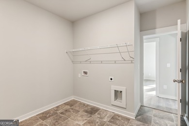 Beautiful Ranch-Style Home in the Tranquil Golf Course Community on Traditions of Braselton Golf Club in Georgia - for sale on GolfHomes.com, golf home, golf lot