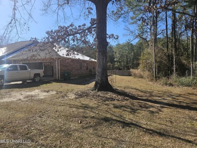 Beautifully half of a duplex located in the sought-after on Diamondhead Country Club in Mississippi - for sale on GolfHomes.com, golf home, golf lot