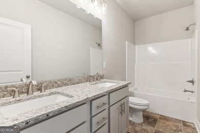 Beautiful Ranch-Style Home in the Tranquil Golf Course Community on Traditions of Braselton Golf Club in Georgia - for sale on GolfHomes.com, golf home, golf lot