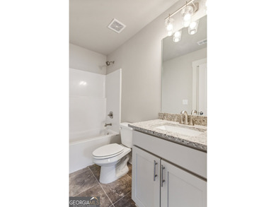 Beautiful Ranch-Style Home in the Tranquil Golf Course Community on Traditions of Braselton Golf Club in Georgia - for sale on GolfHomes.com, golf home, golf lot