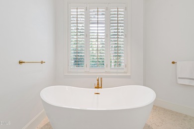 It's here, at the end of a quiet cul-de-sac, you immediately on TPC at Wakefield Plantation in North Carolina - for sale on GolfHomes.com, golf home, golf lot