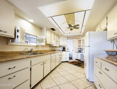 Love where you live in this mid-century modern 2 bedroom 2 bath on Sun City Lakes West and East in Arizona - for sale on GolfHomes.com, golf home, golf lot