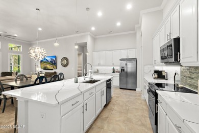 Nestled inside the guard gated, golf-cart-friendly community of on Plantation Bay Golf and Country Club in Florida - for sale on GolfHomes.com, golf home, golf lot