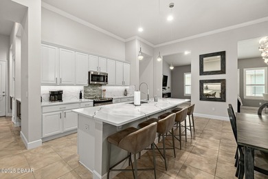 Nestled inside the guard gated, golf-cart-friendly community of on Plantation Bay Golf and Country Club in Florida - for sale on GolfHomes.com, golf home, golf lot