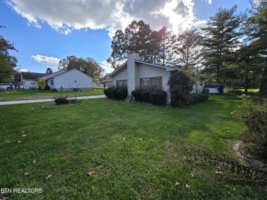 Enjoy golf frontage in your backyard while on the main drag of on Lake Tansi Village Country Club in Tennessee - for sale on GolfHomes.com, golf home, golf lot