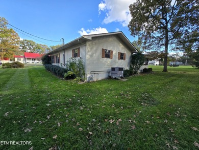 Enjoy golf frontage in your backyard while on the main drag of on Lake Tansi Village Country Club in Tennessee - for sale on GolfHomes.com, golf home, golf lot