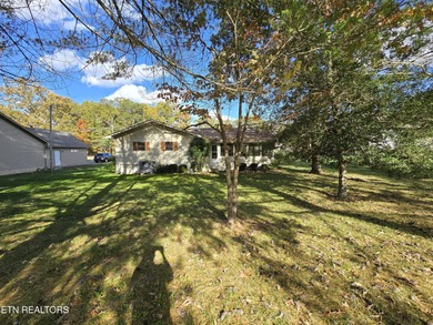 Enjoy golf frontage in your backyard while on the main drag of on Lake Tansi Village Country Club in Tennessee - for sale on GolfHomes.com, golf home, golf lot
