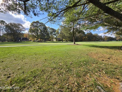 Enjoy golf frontage in your backyard while on the main drag of on Lake Tansi Village Country Club in Tennessee - for sale on GolfHomes.com, golf home, golf lot
