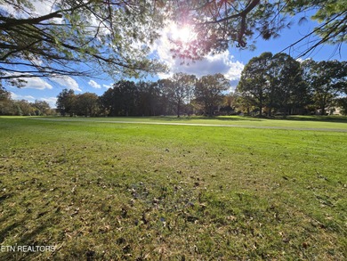 Enjoy golf frontage in your backyard while on the main drag of on Lake Tansi Village Country Club in Tennessee - for sale on GolfHomes.com, golf home, golf lot