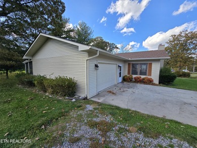 Enjoy golf frontage in your backyard while on the main drag of on Lake Tansi Village Country Club in Tennessee - for sale on GolfHomes.com, golf home, golf lot