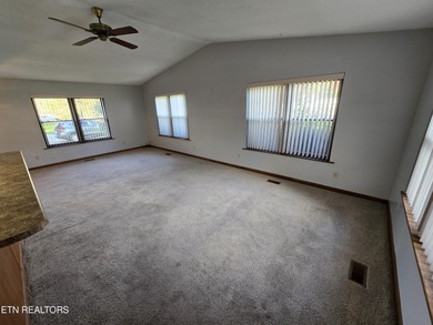 Enjoy golf frontage in your backyard while on the main drag of on Lake Tansi Village Country Club in Tennessee - for sale on GolfHomes.com, golf home, golf lot