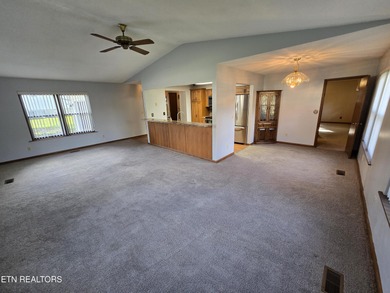 Enjoy golf frontage in your backyard while on the main drag of on Lake Tansi Village Country Club in Tennessee - for sale on GolfHomes.com, golf home, golf lot