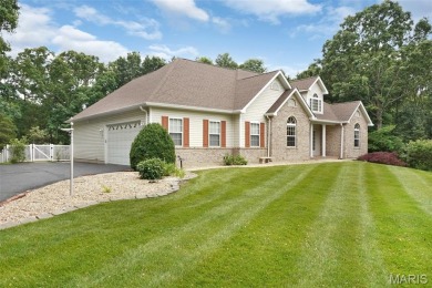 Welcome to resort-style living in this lovely custom ranch with on Raintree Country Club in Missouri - for sale on GolfHomes.com, golf home, golf lot