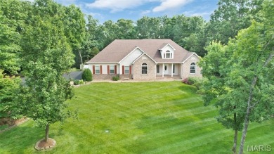 Welcome to resort-style living in this lovely custom ranch with on Raintree Country Club in Missouri - for sale on GolfHomes.com, golf home, golf lot