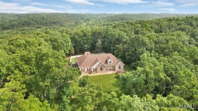 Welcome to resort-style living in this lovely custom ranch with on Raintree Country Club in Missouri - for sale on GolfHomes.com, golf home, golf lot