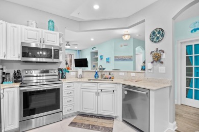 Enjoy low-maintenance resort living in this spacious 3-bedroom on Barefoot Resort and Golf Club  in South Carolina - for sale on GolfHomes.com, golf home, golf lot