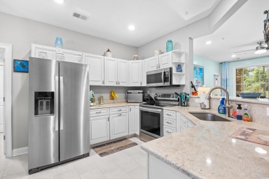 Enjoy low-maintenance resort living in this spacious 3-bedroom on Barefoot Resort and Golf Club  in South Carolina - for sale on GolfHomes.com, golf home, golf lot