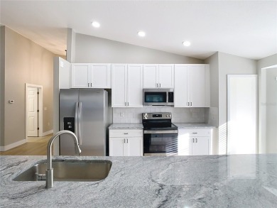 COMPLETELY REMODELED 3/2/3 in GORGEOUS Lake Bernadette! This on The Links of Lake Bernadette in Florida - for sale on GolfHomes.com, golf home, golf lot