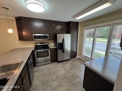 Welcome to easy living in this beautifully maintained 2-bedroom on Wilson Country Club in North Carolina - for sale on GolfHomes.com, golf home, golf lot