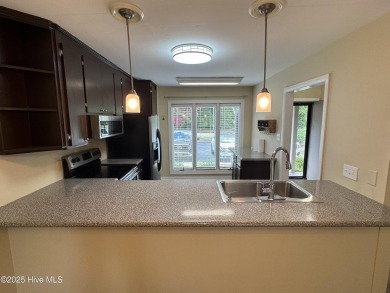 Welcome to easy living in this beautifully maintained 2-bedroom on Wilson Country Club in North Carolina - for sale on GolfHomes.com, golf home, golf lot