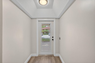 Enjoy effortless living in this beautifully remodeled 2-bedroom on PGA National Golf Club in Florida - for sale on GolfHomes.com, golf home, golf lot