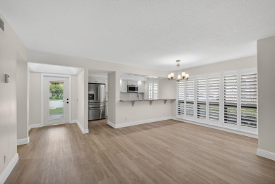 Enjoy effortless living in this beautifully remodeled 2-bedroom on PGA National Golf Club in Florida - for sale on GolfHomes.com, golf home, golf lot