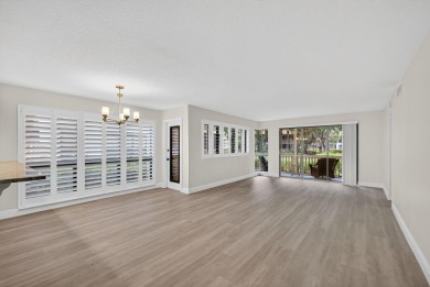 Enjoy effortless living in this beautifully remodeled 2-bedroom on PGA National Golf Club in Florida - for sale on GolfHomes.com, golf home, golf lot