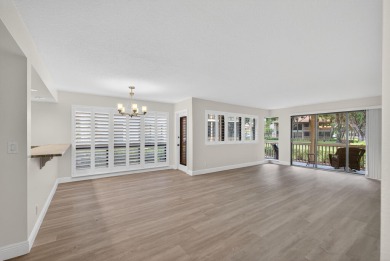 Enjoy effortless living in this beautifully remodeled 2-bedroom on PGA National Golf Club in Florida - for sale on GolfHomes.com, golf home, golf lot
