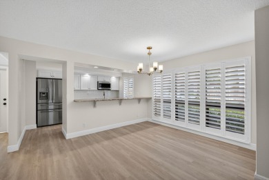 Enjoy effortless living in this beautifully remodeled 2-bedroom on PGA National Golf Club in Florida - for sale on GolfHomes.com, golf home, golf lot