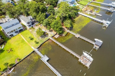 Discover the ultimate coastal living experience on this prime on Founders Club At St. James Plantation in North Carolina - for sale on GolfHomes.com, golf home, golf lot