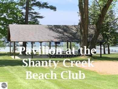STUDIO CHARM! Studio condo with sunset views of Lake Belaire and on Shanty Creek Golf Course in Michigan - for sale on GolfHomes.com, golf home, golf lot
