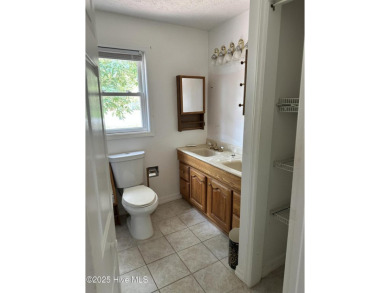 Discover the ultimate coastal living experience on this prime on Founders Club At St. James Plantation in North Carolina - for sale on GolfHomes.com, golf home, golf lot