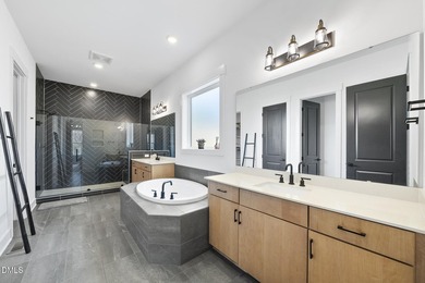 Tucked away on a quiet cul-de-sac in the prestigious Hasentree on Hasentree Club in North Carolina - for sale on GolfHomes.com, golf home, golf lot