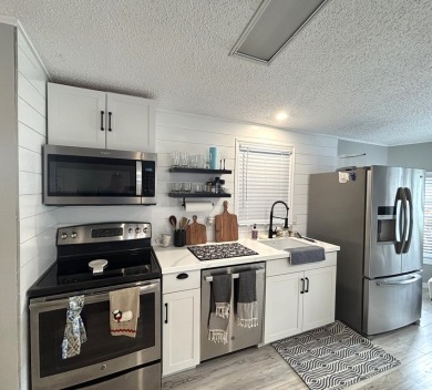 This home is located within a 55 + resort style leased land on Big Cypress Golf and Country Club in Florida - for sale on GolfHomes.com, golf home, golf lot