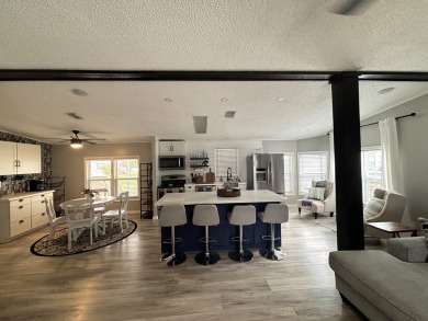 This home is located within a 55 + resort style leased land on Big Cypress Golf and Country Club in Florida - for sale on GolfHomes.com, golf home, golf lot